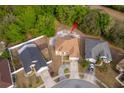 Overhead view of a cozy single-Gathering home on a lot with mature trees and surrounded by fenced yards at 2507 Monaco Cove Cir, Orlando, FL 32825