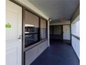 Exterior hallway with doors, windows, railings, and exit sign at 5245 W Irlo Bronson Memorial Hwy # 244, Kissimmee, FL 34746