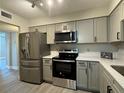 Updated kitchen featuring stainless steel appliances and modern cabinets at 544 Orange Dr # 10, Altamonte Springs, FL 32701