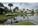 Tranquil lake view with boats and lush landscaping framing the residence at 544 Orange Dr # 10, Altamonte Springs, FL 32701