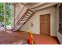 Exterior staircase leading to upper unit entrance with red caution tape for tripping hazard at 544 Orange Dr # 10, Altamonte Springs, FL 32701