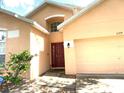Charming single-Gathering home with a well-manicured lawn and a cozy front porch at 2109 Woodsedge Dr, Kissimmee, FL 34746