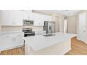 Well-equipped kitchen featuring an island, stainless steel appliances, and ample counter space at 814 Ballantyne Dr, Lake Wales, FL 33898