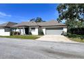 Charming single-story home with a two-car garage and well-maintained landscaping at 1493 Magellan Cir # 504, Orlando, FL 32818