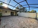 Screened patio with brick pavers and ample space for outdoor living and entertaining at 1493 Magellan Cir # 504, Orlando, FL 32818