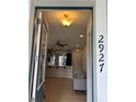 Front entry with view into living room and kitchen at 2927 Windmill Dr, Kissimmee, FL 34741