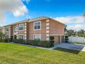 Side view of a two-story house showcasing garage and landscaping at 4610 Salamander St, St Cloud, FL 34772