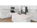Bright, modern kitchen with stainless steel appliances and a large center island at 2007 Stetson Ave, Eagle Lake, FL 33839