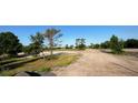 Expansive, undeveloped lot ready for building, nestled among mature trees and promising privacy at 3664 Cord Ave, St Cloud, FL 34772