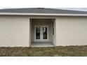 Private back patio accessible through double French doors at 1415 Orlando Way, Kissimmee, FL 34759