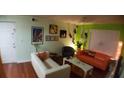 Spacious living room featuring two sofas and wood floors at 2041 Dixie Belle Dr # 2041P, Orlando, FL 32812