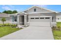 This home has stone veneer accents and well-maintained landscaping at 4060 Bannock Ave, Tavares, FL 32778
