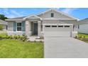 Beautiful home featuring stone accents, great landscaping, and a two-car garage at 4060 Bannock Ave, Tavares, FL 32778