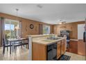 Bright, open kitchen featuring stainless steel appliances and a breakfast bar with seating at 4523 Ashtubula Ct, Orlando, FL 32818