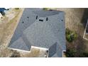 Aerial view of newly installed shingle roof with proper ventilation system at 4523 Ashtubula Ct, Orlando, FL 32818