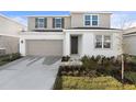 Charming two-story home with a well-maintained lawn and neutral color scheme at 5418 Catmint Dr, Lake Hamilton, FL 33851