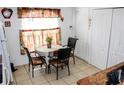 Cozy eat in kitchen featuring a breakfast nook with tile floors and natural light at 1053 Hemingway Dr, Deltona, FL 32725