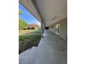 Covered porch with concrete flooring and view of the backyard at 2728 Adair Rd, Davenport, FL 33837