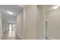 Bright hallway showcasing modern flooring and a seamless transition to the main living areas at 1569 Thetford Cir, Orlando, FL 32824
