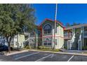 A beautiful exterior elevation featuring multi-level access, large windows, and manicured landscaping at 3151 Britannia Blvd # C, Kissimmee, FL 34747