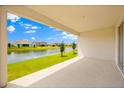 Cozy covered patio offering stunning views of the pond and backyard landscape at 2949 Nottel Dr, St Cloud, FL 34772