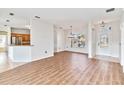 Bright dining room with wood-look floors and chandelier at 3634 Northwoods Dr, Kissimmee, FL 34746