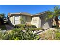 Single-story house with attached garage and landscaping at 605 Grand Canal Drive, Poinciana, FL 34759