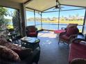 Relaxing screened porch overlooking a lake at 605 Grand Canal Drive, Poinciana, FL 34759
