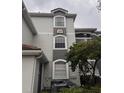 Building exterior showcasing architectural details and landscaping at 13838 Fairway Island Dr # 1432, Orlando, FL 32837