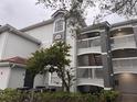 Building exterior with stairs and landscaping at 13838 Fairway Island Dr # 1432, Orlando, FL 32837