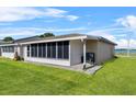 Well-kept enclosed lanai, perfect for enjoying the outdoors in comfort at 392 Winter Ridge Blvd # 105, Winter Haven, FL 33881