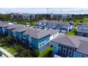 Aerial view of a well-maintained neighborhood with modern townhomes and community amenities at 6078 Bimini Twist Loop, Orlando, FL 32819