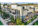 Contemporary townhome exterior featuring private balconies, modern design, and well-maintained landscaping at 1800 Houston St, Kissimmee, FL 34743