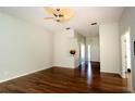 Hardwood floor living room with access to the front door and other rooms at 504 Ridge View Dr, Davenport, FL 33837