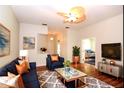 Spacious living room with hardwood floors and stylish furniture at 504 Ridge View Dr, Davenport, FL 33837