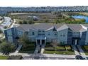 Townhome community with lake and conservation views at 890 Pebble Beach Dr, Davenport, FL 33896