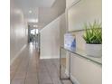 Bright and spacious entryway with tile floors and glass-top table at 890 Pebble Beach Dr, Davenport, FL 33896