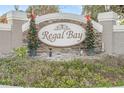 Regal Bay community entrance sign with festive holiday decor at 1465 Riviera Dr, Kissimmee, FL 34744