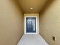 Inviting front door entryway with neutral colored walls at 1940 Banner Ln, St Cloud, FL 34769