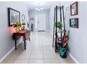 Open and airy hallway with tile flooring and decorative elements at 1940 Banner Ln, St Cloud, FL 34769