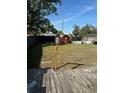 Large backyard with a deck that could be great for outdoor entertaining at 1700 Kentucky Ave, St Cloud, FL 34769