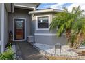 Inviting home exterior with walkway, landscaping, and a welcoming entryway at 113 Promenade Ct, Auburndale, FL 33823