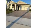 One-story home with a two-car garage and a brick paver driveway at 14827 Milfoil Ave, Orlando, FL 32827