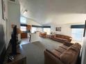 Bright and spacious living room with adjoining kitchen and dining areas at 2981 Kokomo Loop, Haines City, FL 33844