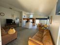 Open living area with a view of kitchen, dining area and pool at 2981 Kokomo Loop, Haines City, FL 33844