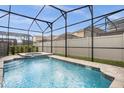 Screened-in pool with jacuzzi and a spacious backyard at 9022 Pelican Cove Trce, Kissimmee, FL 34747