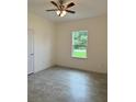Bright bedroom with tile flooring and a ceiling fan at 1810 Dunbar St, Bartow, FL 33830