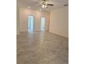 Spacious living room featuring tile floors and access to other rooms at 1810 Dunbar St, Bartow, FL 33830