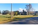 Vacant lot with a grassy area and white fence at 2831 Rodeo Dr, Kissimmee, FL 34746
