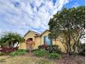 House exterior with landscaping and palm trees at 304 Sorrento Road, Poinciana, FL 34759